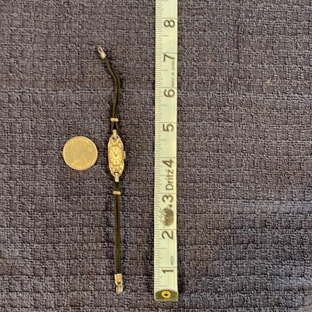 Antique slim watch with black rope band